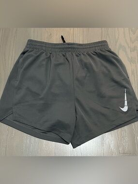 NWOT. Nike Dri-FIT Boys Shorts — Charcoal Gray. Brief lining, pockets.
